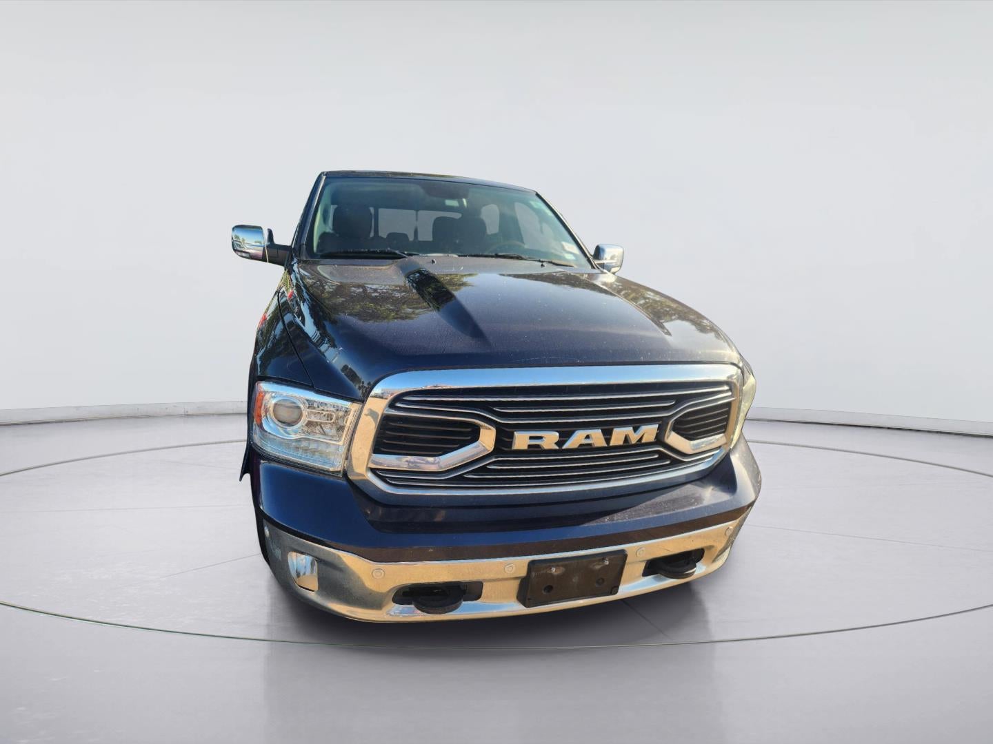 2018 RAM 1500 Longhorn in True Blue Pearlcoat — front three-quarter view