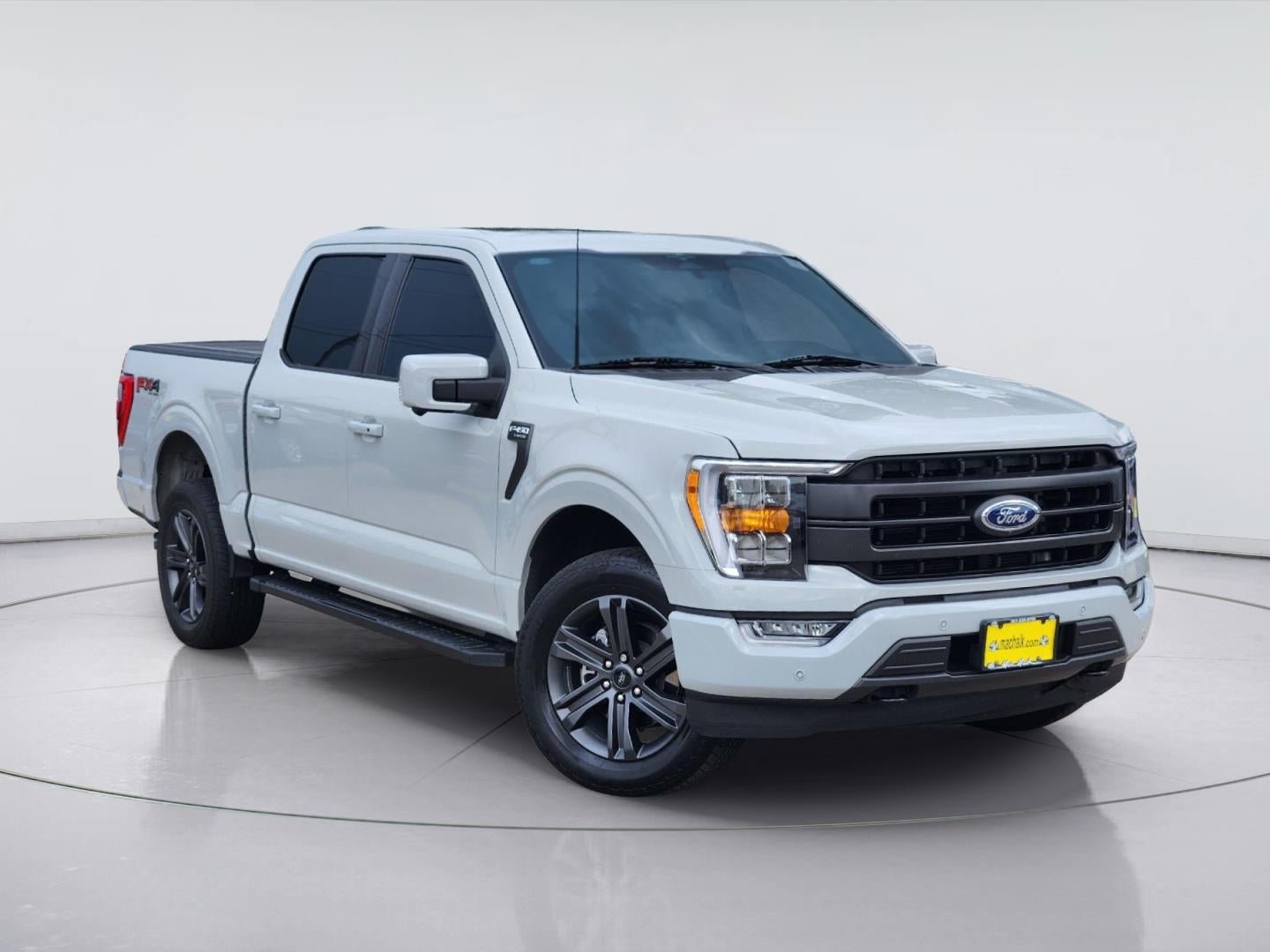 2023 Ford F-150 LARIAT in Avalanche Gray — front three-quarter view