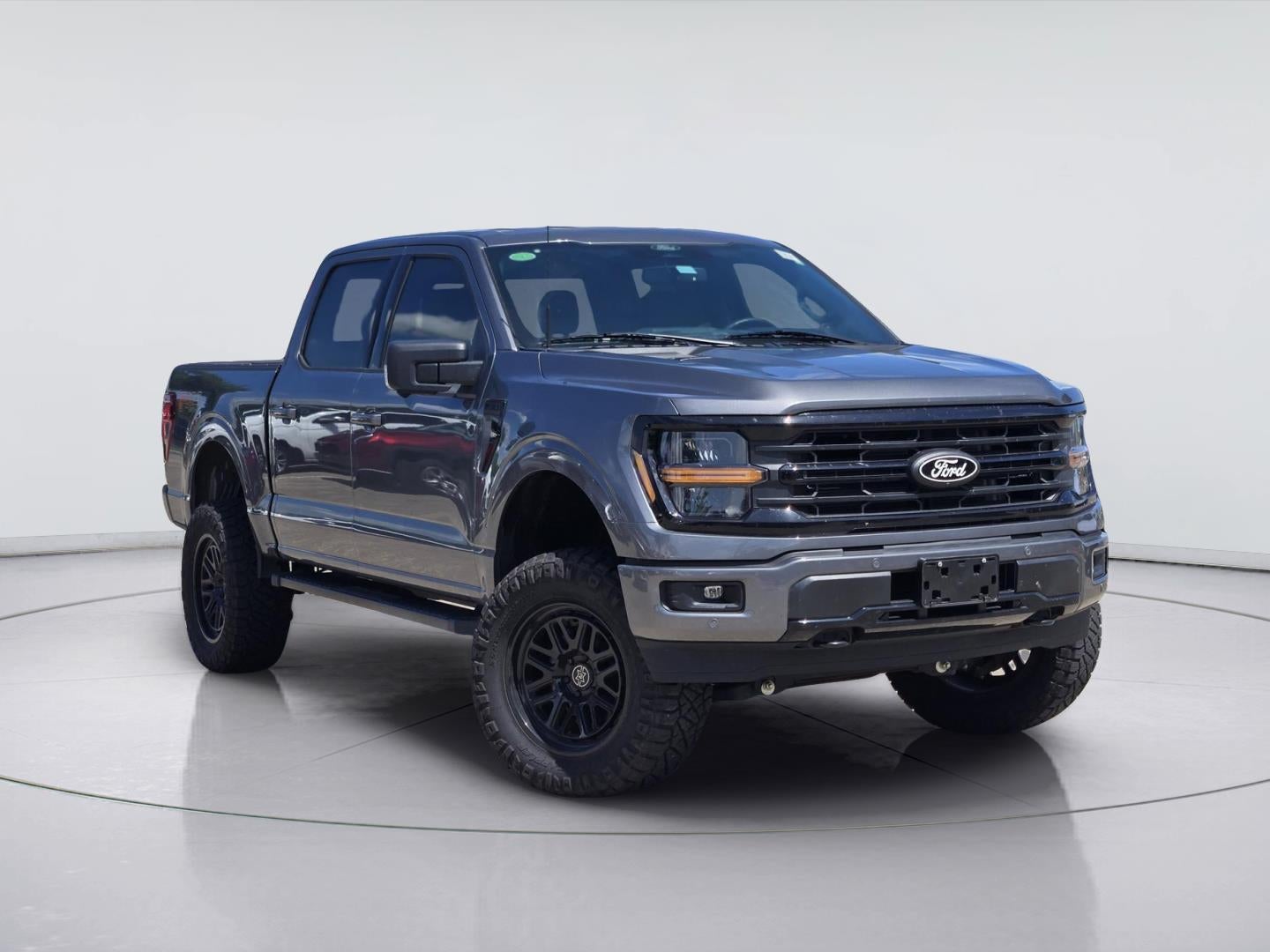 2025 Ford F-150 XLT in Carbonized Gray — front three-quarter view