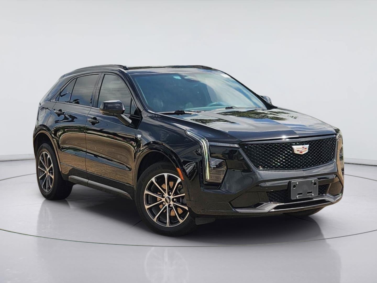 2024 Cadillac XT4 FWD Sport in Stellar Black Metallic — front three-quarter view