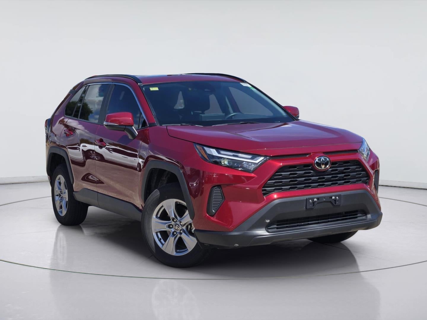2025 Toyota RAV4 XLE in Ruby Flare Pearl — front three-quarter view