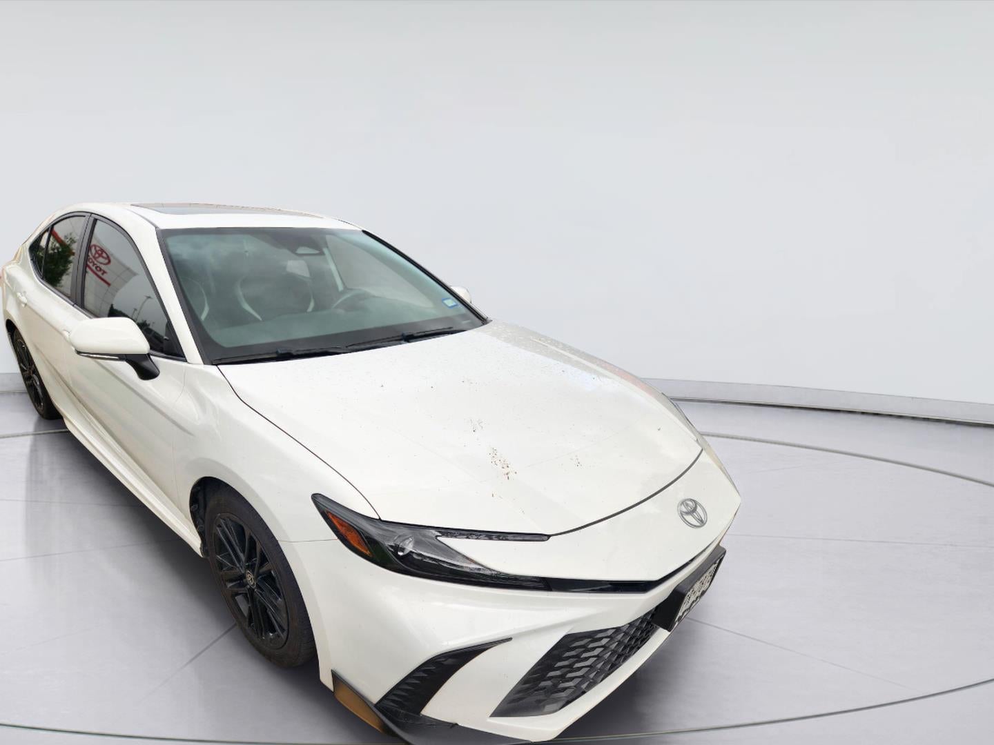 2025 Toyota Camry SE in Ice Cap — front three-quarter view