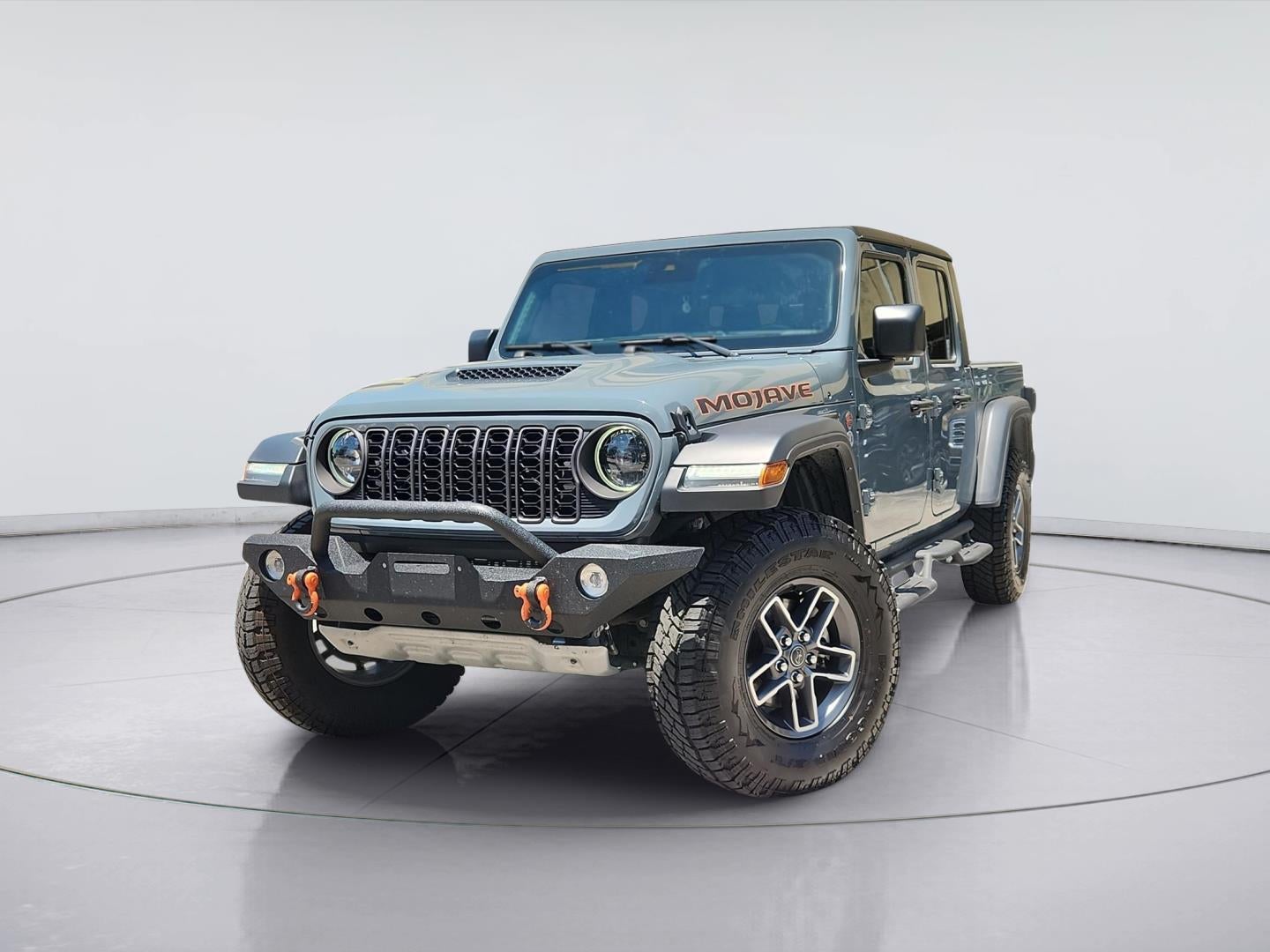 2024 Jeep Gladiator Mojave in Anvil Clear Coat — front three-quarter view