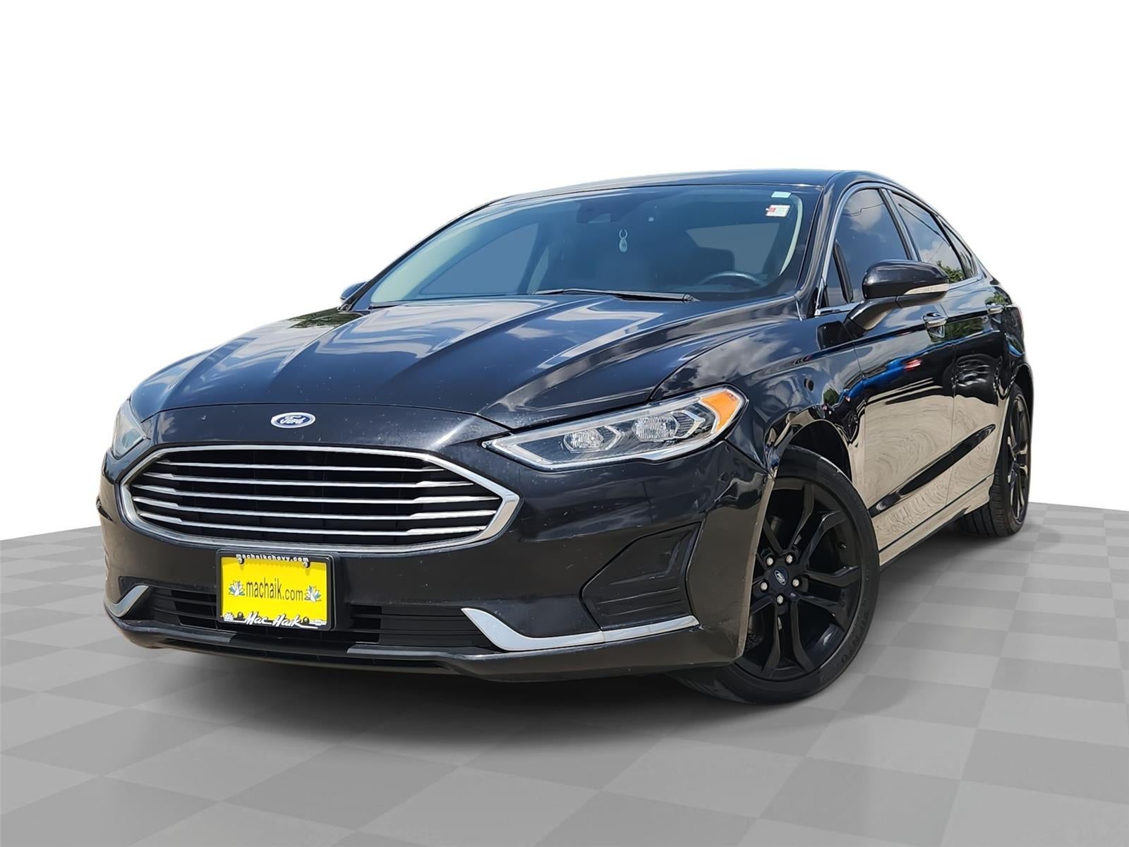 2019 Ford Fusion SEL in Agate Black — front three-quarter view