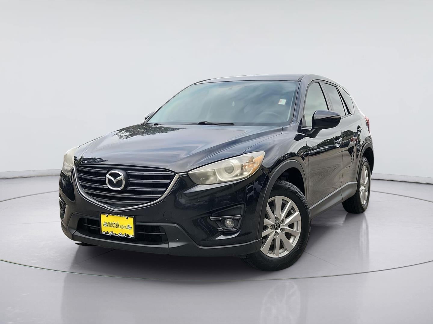 2016 Mazda Mazda CX-5 Touring in Jet Black Mica — front three-quarter view