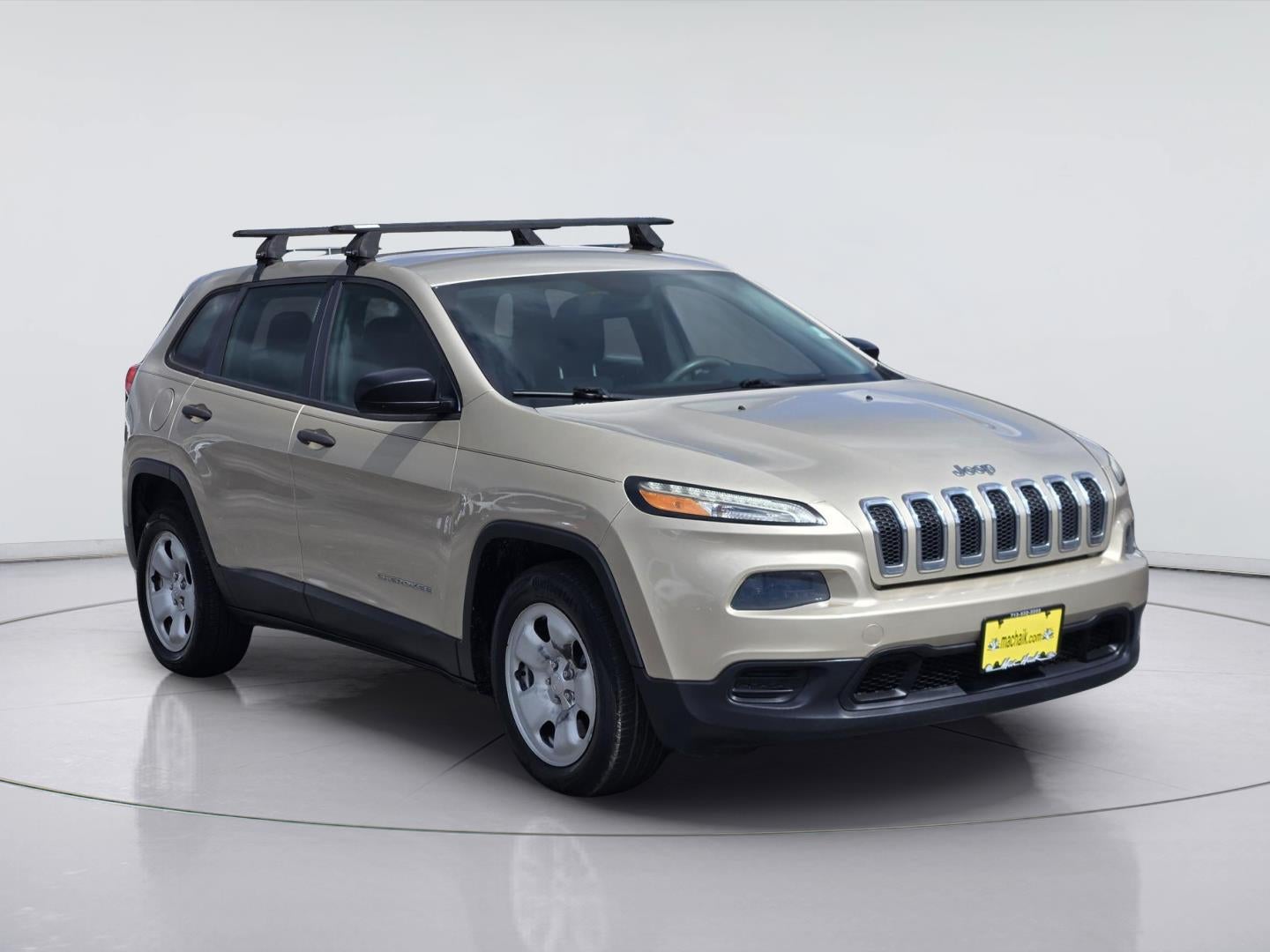 2014 Jeep Cherokee — rear three-quarter view
