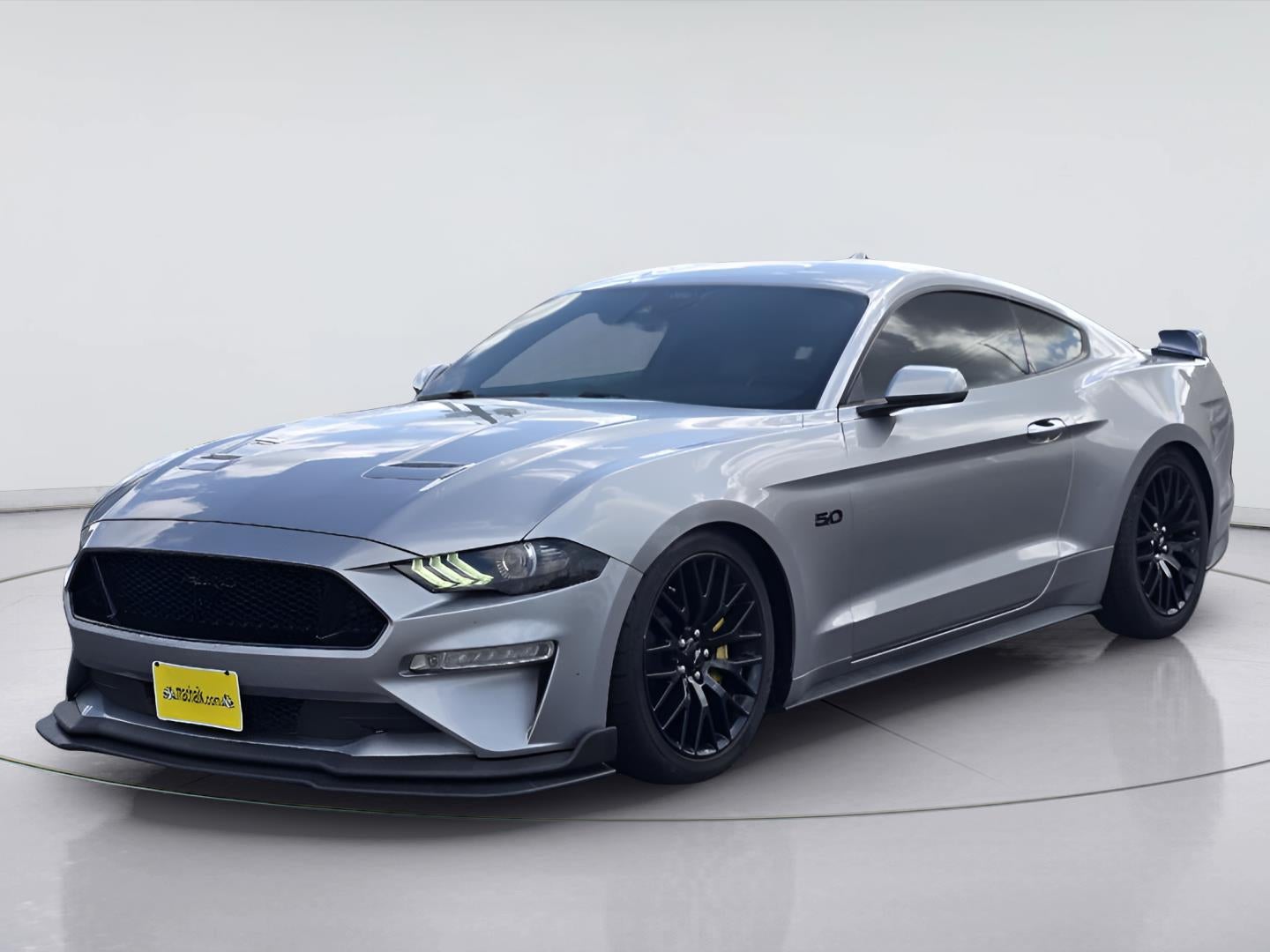2022 Ford Mustang GT Premium in Iconic Silver — front three-quarter view