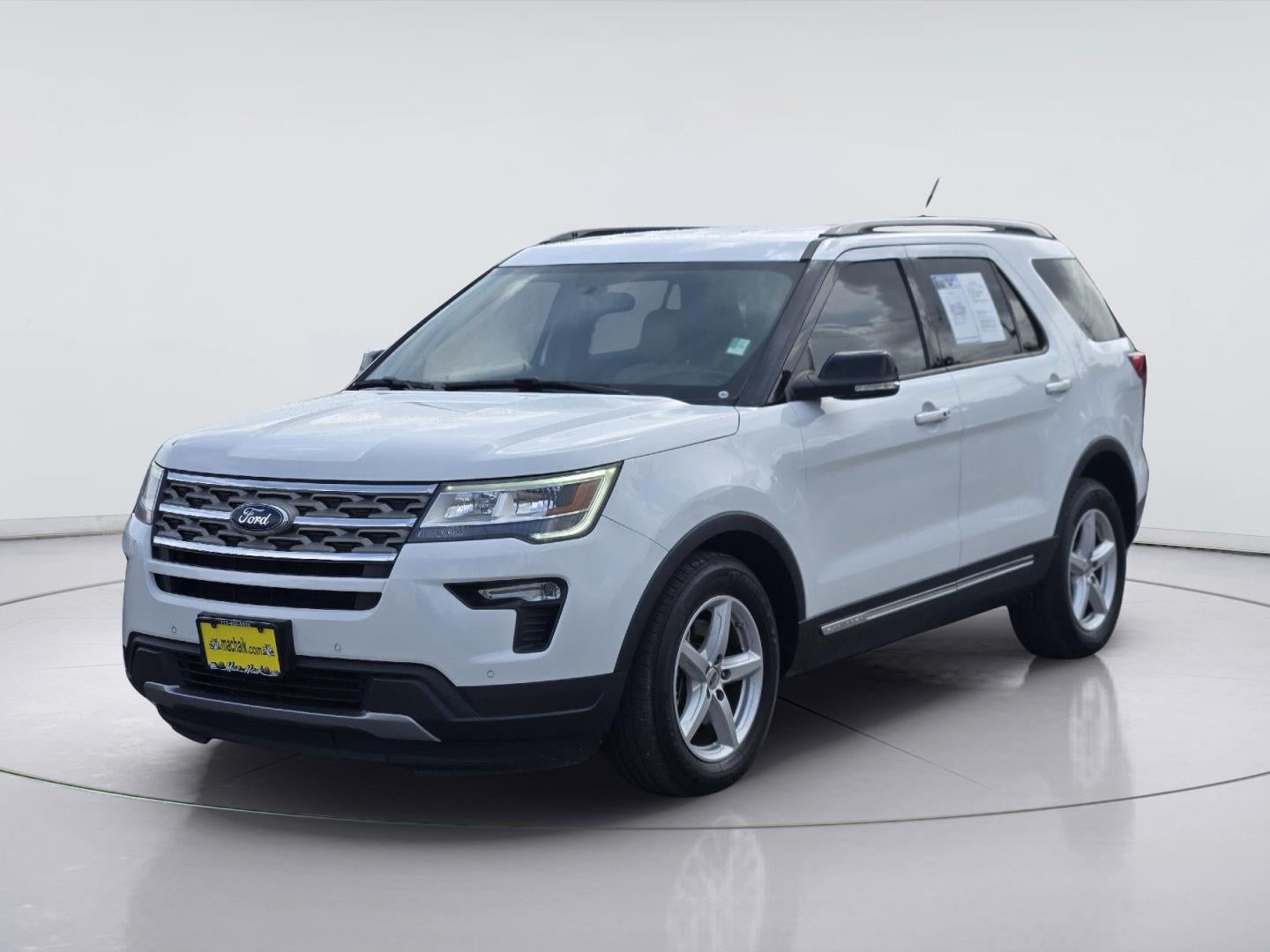 2018 Ford Explorer XLT in Oxford White — front three-quarter view