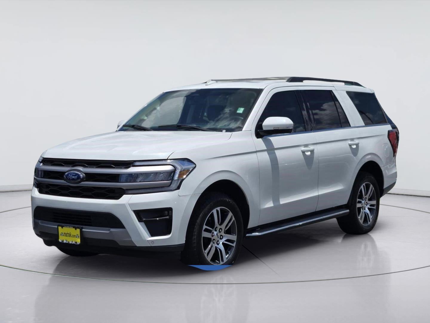2023 Ford Expedition XLT in Star White Metallic Tri-Coat — front three-quarter view