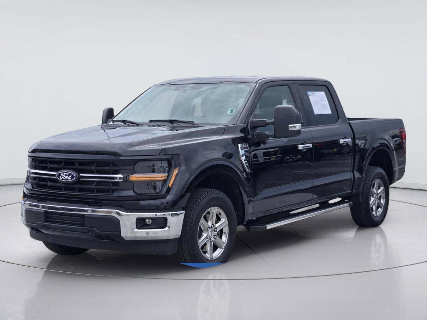 2024 Ford F-150 XLT in Agate Black — front three-quarter view