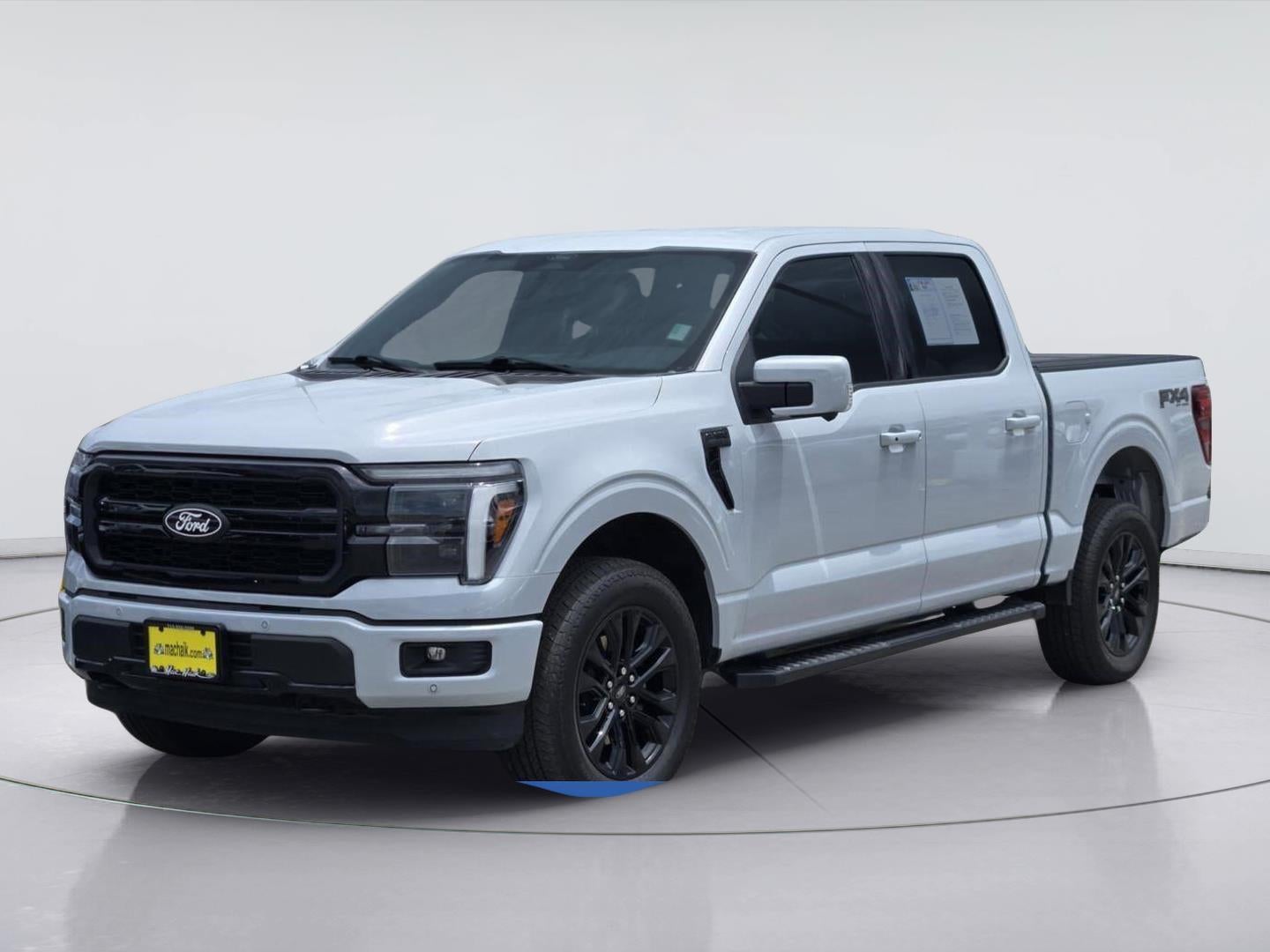 2025 Ford F-150 LARIAT in Space White — front three-quarter view