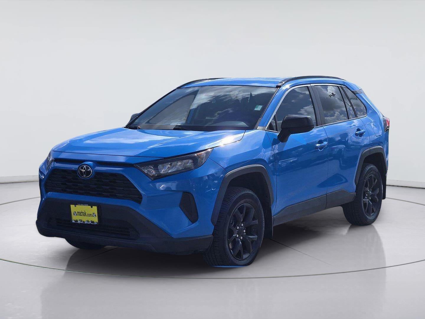 2021 Toyota RAV4 LE in Blue Flame — front three-quarter view