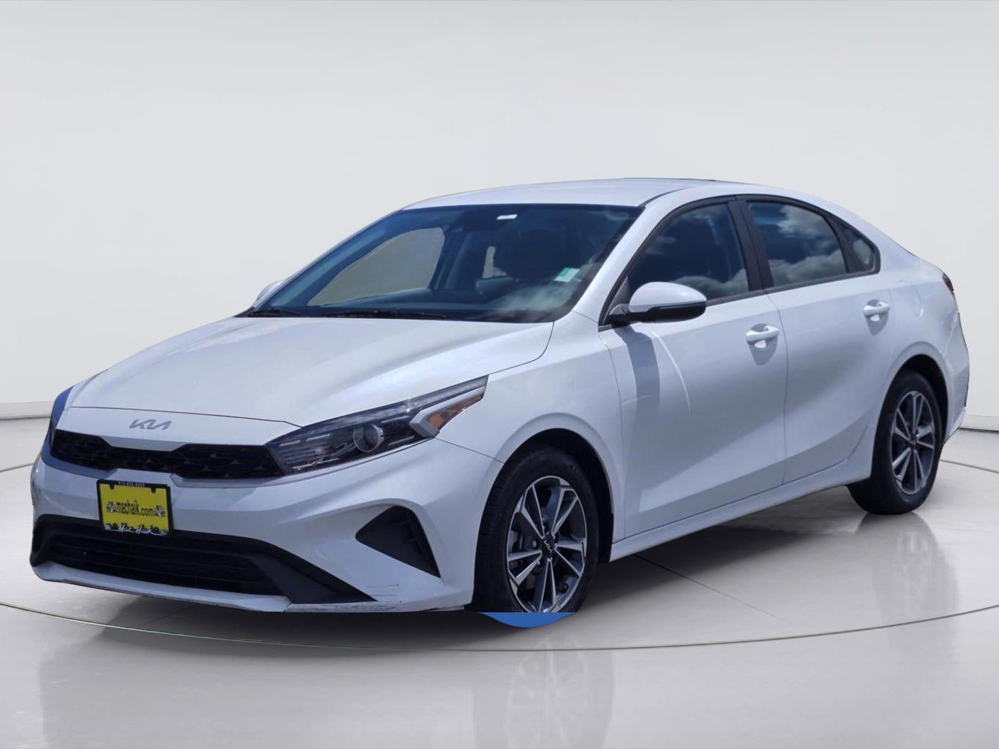 2024 Kia Forte LXS in Snow White Pearl — front three-quarter view