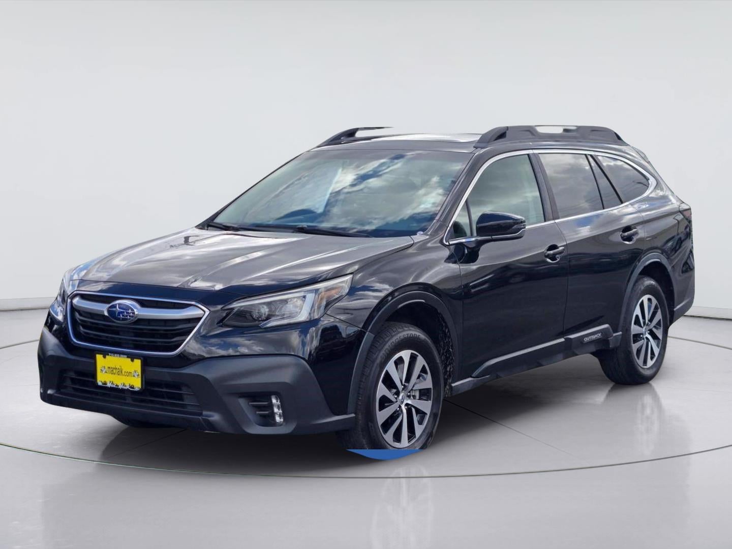 2021 Subaru Outback Premium in Crystal Black Silica — front three-quarter view