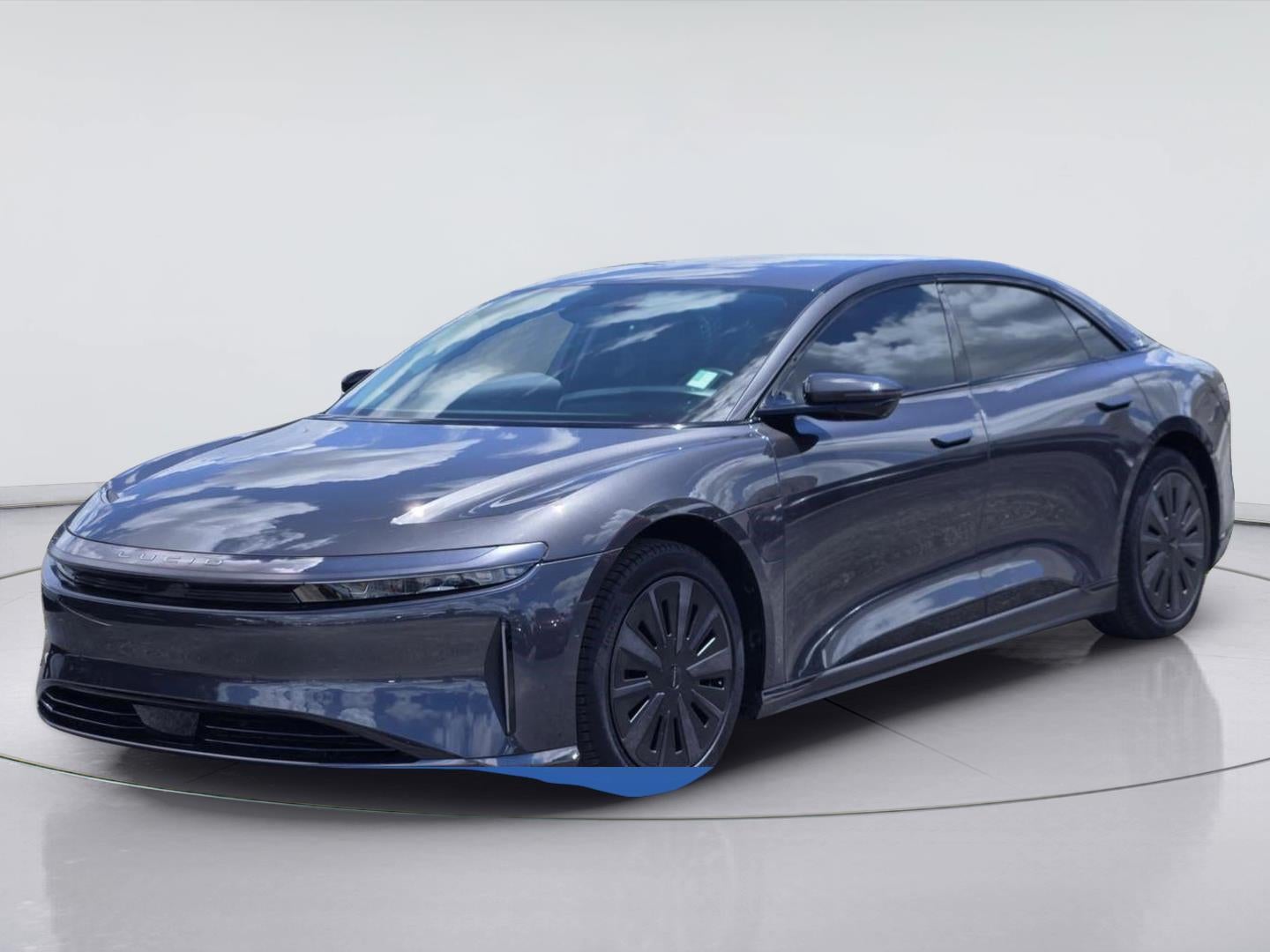 2025 Lucid Air Touring in Quantum Grey Metallic — front three-quarter view