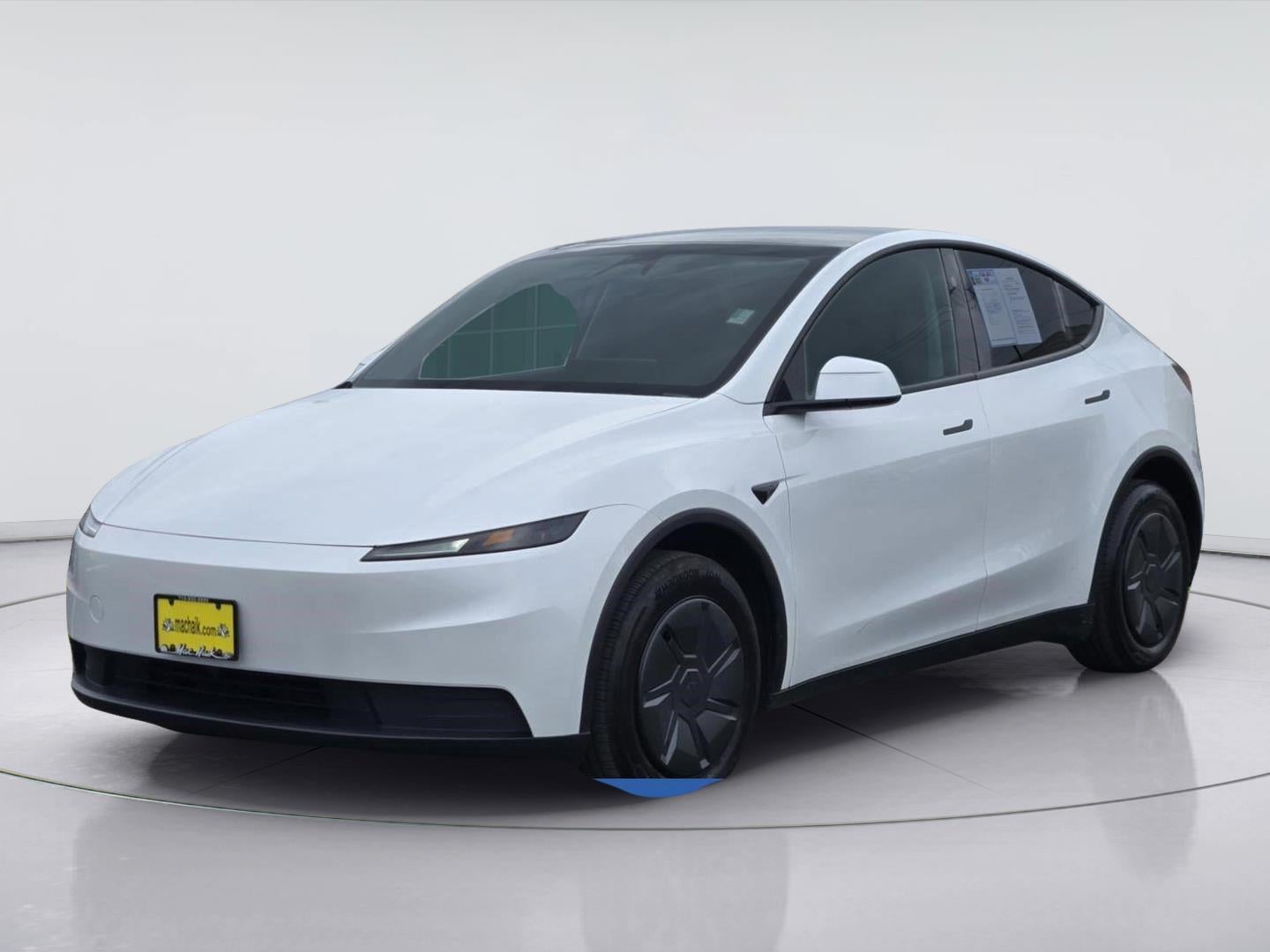 2026 Tesla Model Y Base in Pearl White Multi-Coat — front three-quarter view