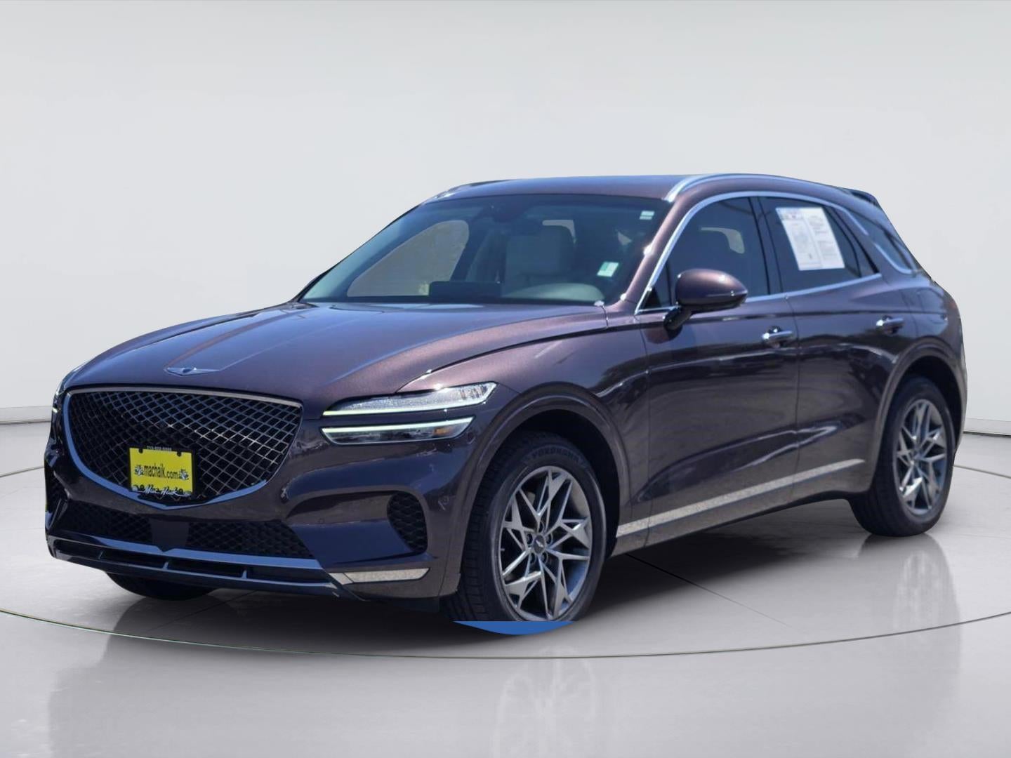 2022 Genesis GV70 2.5T in Barossa Burgundy — front three-quarter view