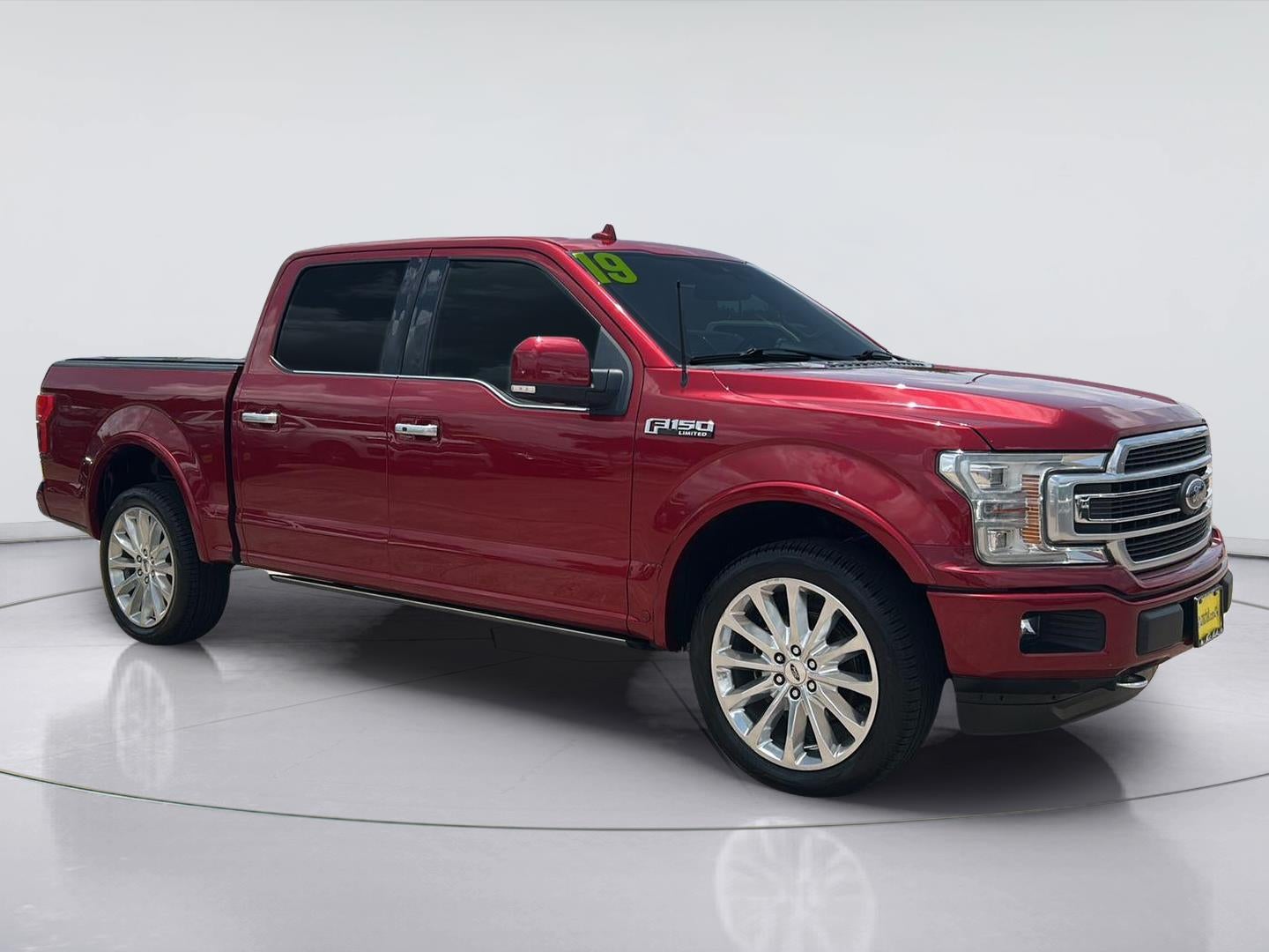 2019 Ford F-150 Limited in Ruby Red Metallic Tinted Clearcoat — front three-quarter view