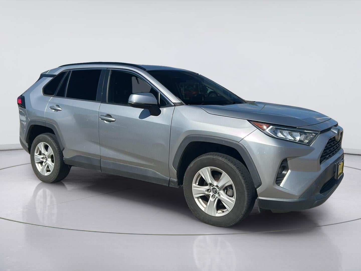 2021 Toyota RAV4 XLE in Silver Sky Metallic — front three-quarter view