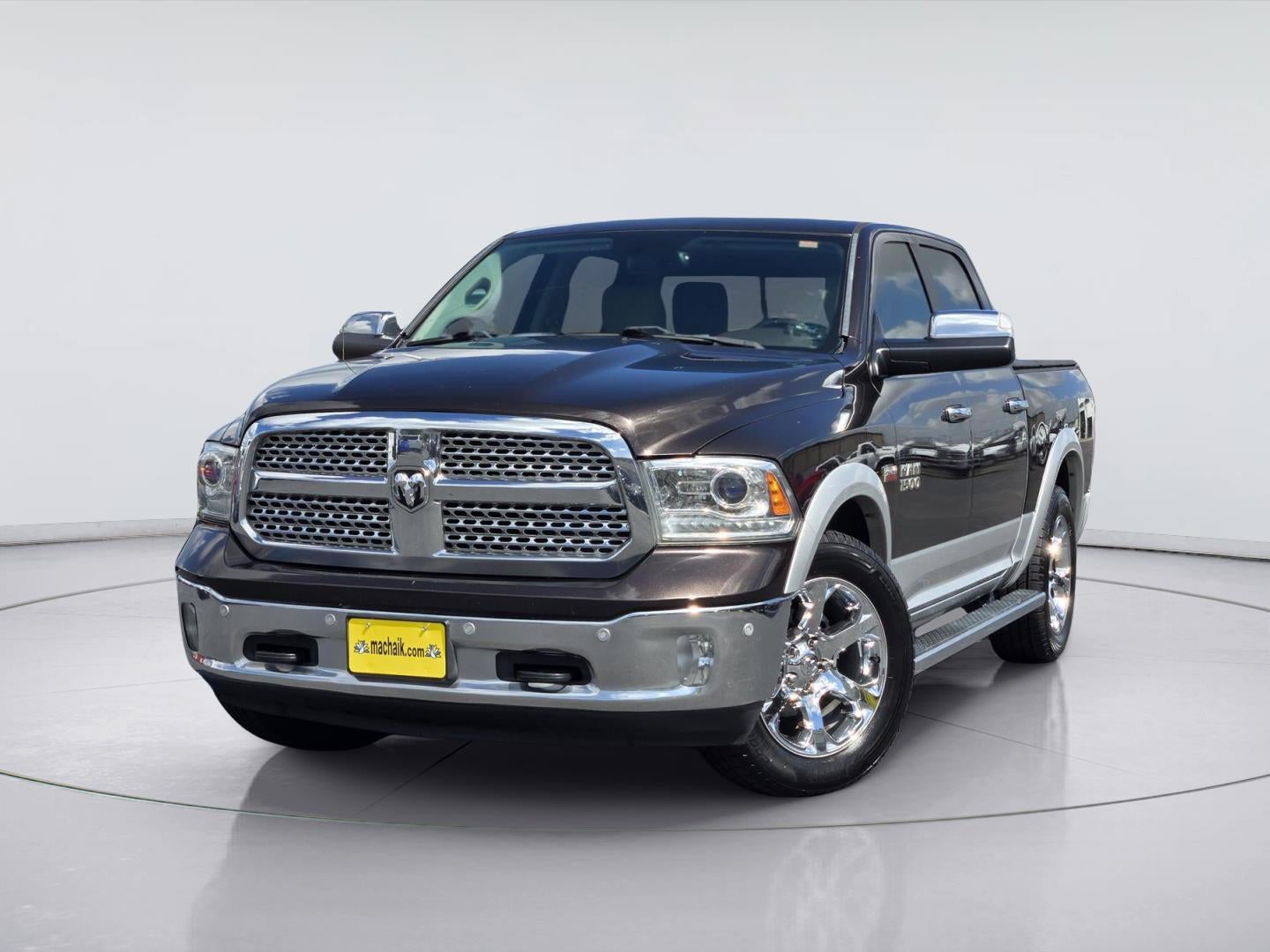 2016 RAM 1500 Laramie in Luxury Brown Pearlcoat — front three-quarter view