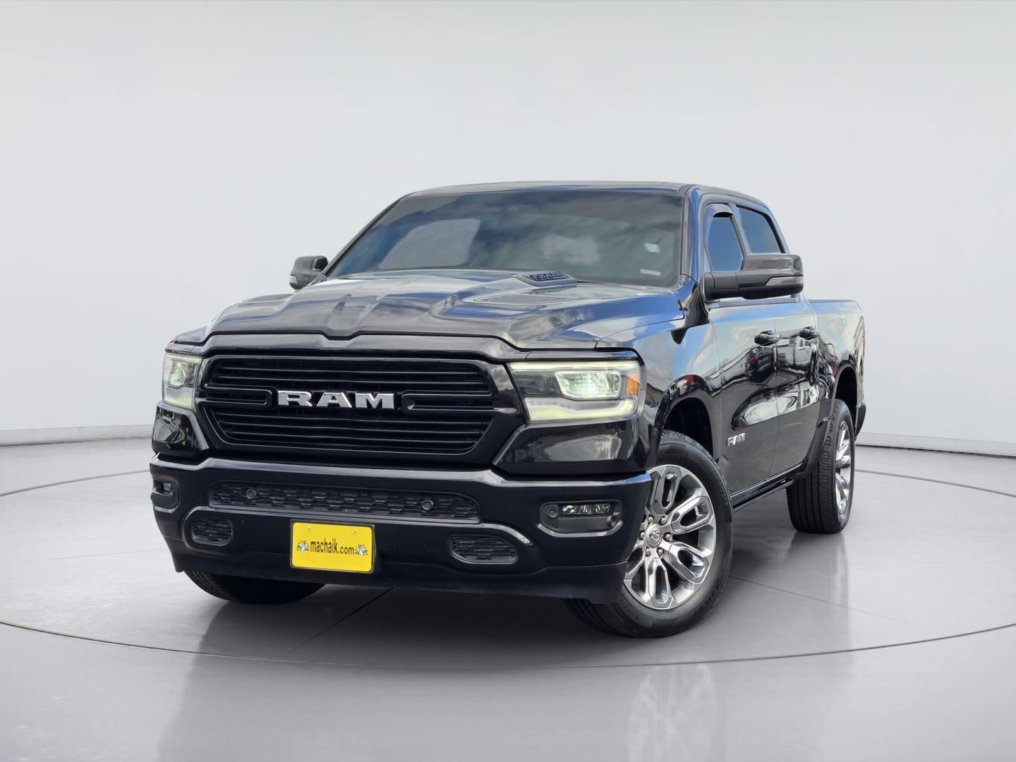 2024 RAM 1500 Laramie in Diamond Black Crystal Pearlcoat — front three-quarter view