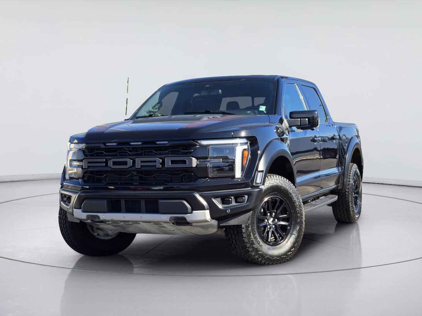 2024 Ford F-150 Raptor in Agate Black — front three-quarter view