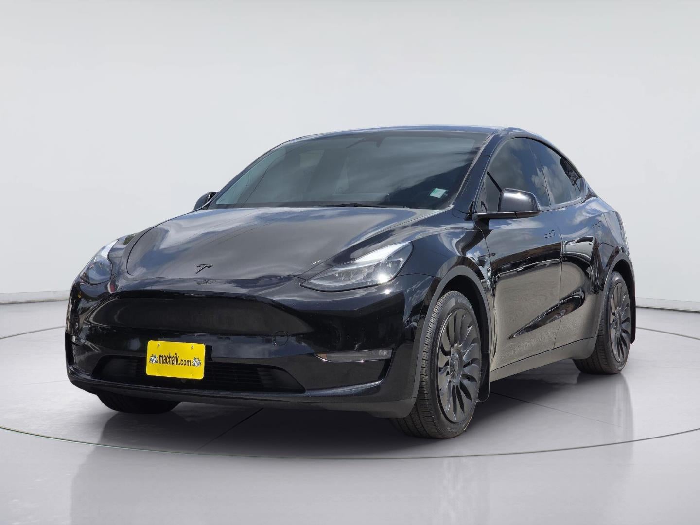 2023 Tesla Model Y Long Range in Solid Black — front three-quarter view