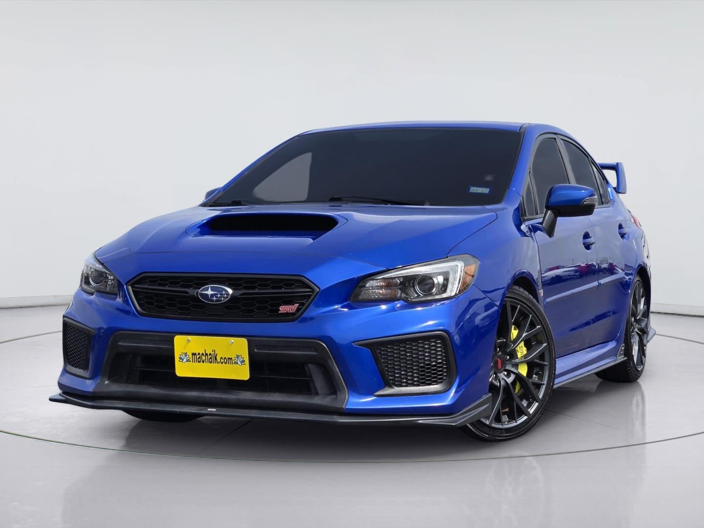 2019 Subaru WRX STI Limited in Wr Blue Pearl — front three-quarter view
