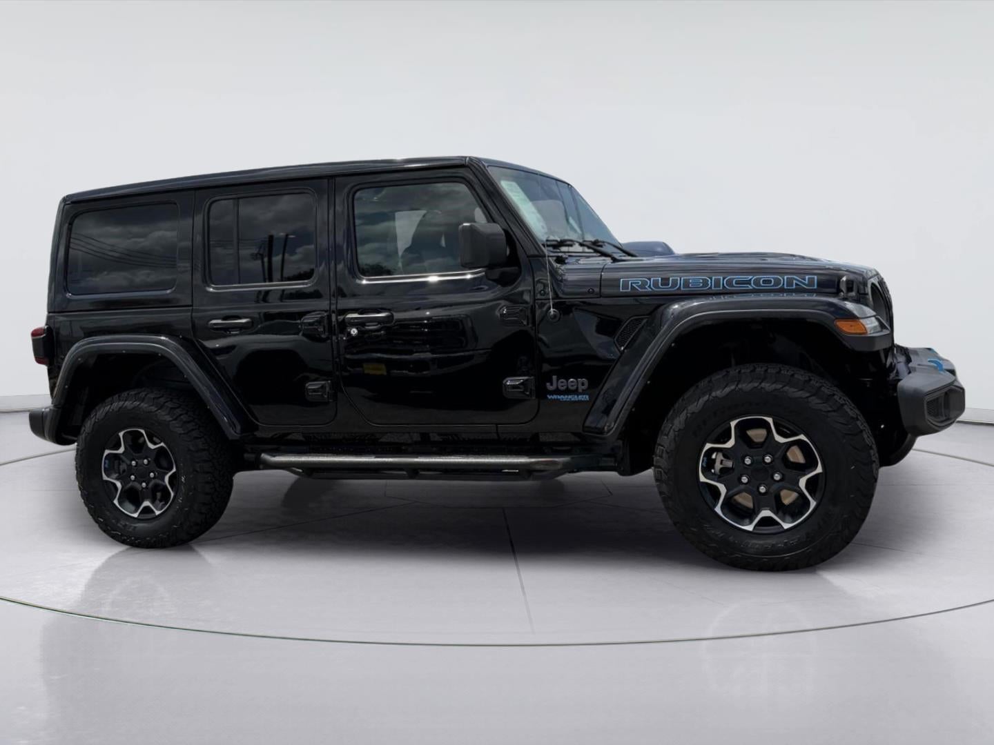 2022 Jeep Wrangler 4xe Unlimited Rubicon in Black Clearcoat — front three-quarter view