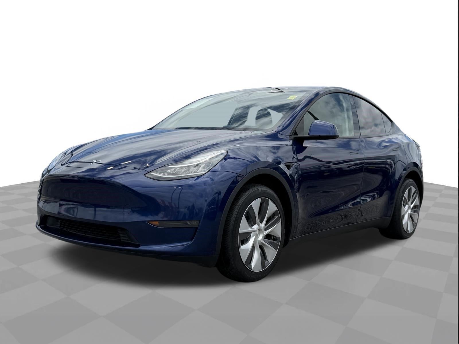 2023 Tesla Model Y Long Range in Deep Blue Metallic — front three-quarter view